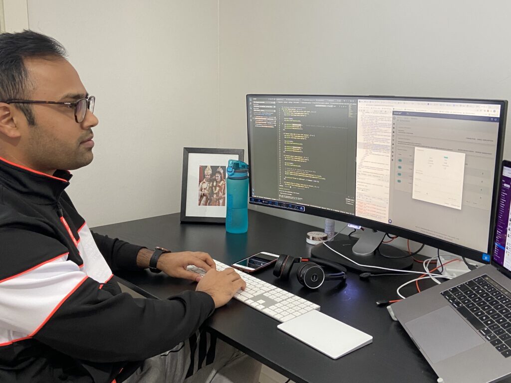 Pongku Paul sitting behind his workstation