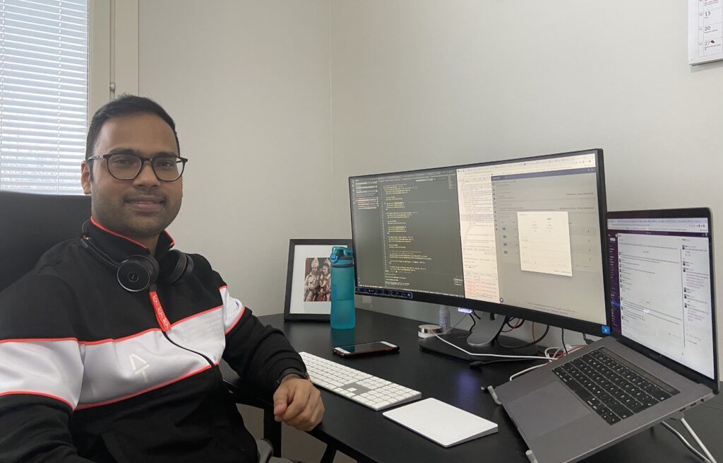 Software developer Pongku Paul sitting at his desk